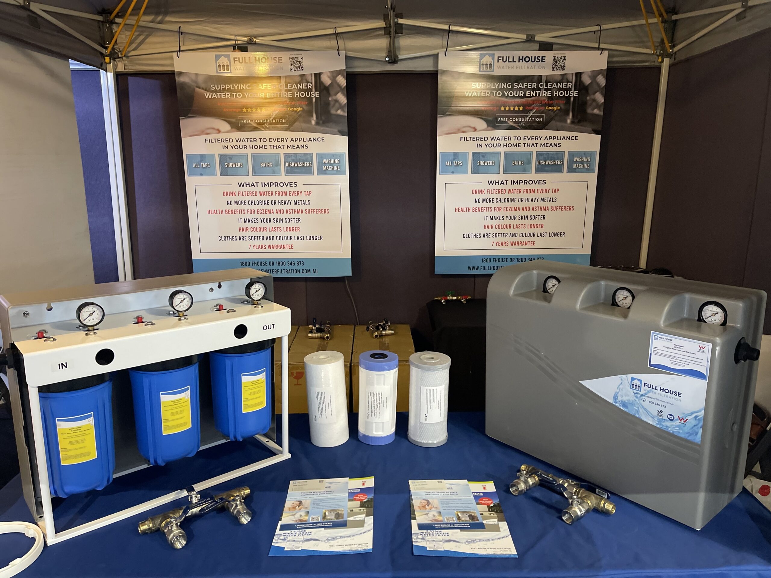 Full House Water booth displays filtration components, filters, and brochures with Flexible Interest options for visitors.